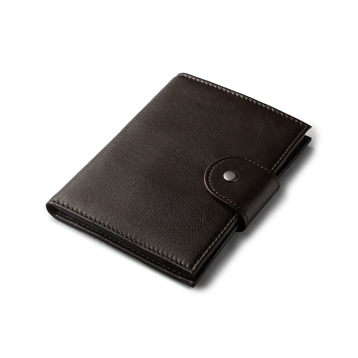 Orbit Smart Passport Holder Bi-Fold in Brown leather with Dolphin Max tracker attached to a passport and travel essentials