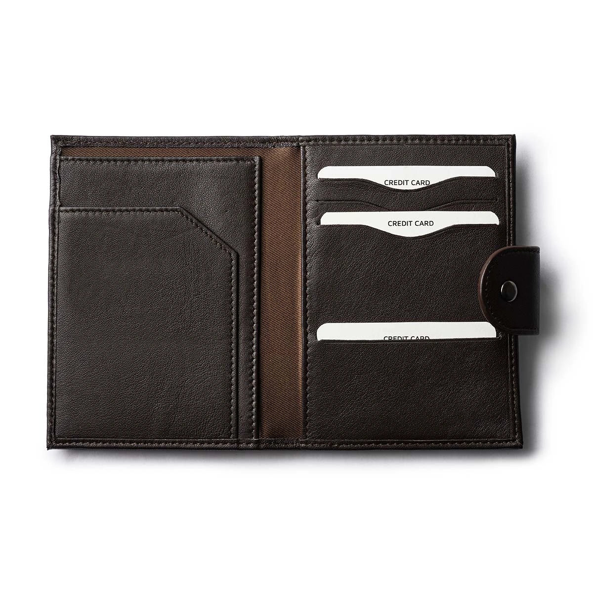 Orbit Smart Passport Holder Bi-Fold in Brown leather with Dolphin Max tracker attached to a passport and travel essentials