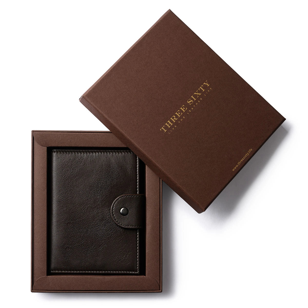 Orbit Smart Passport Holder Bi-Fold in Brown leather with Dolphin Max tracker attached to a passport and travel essentials