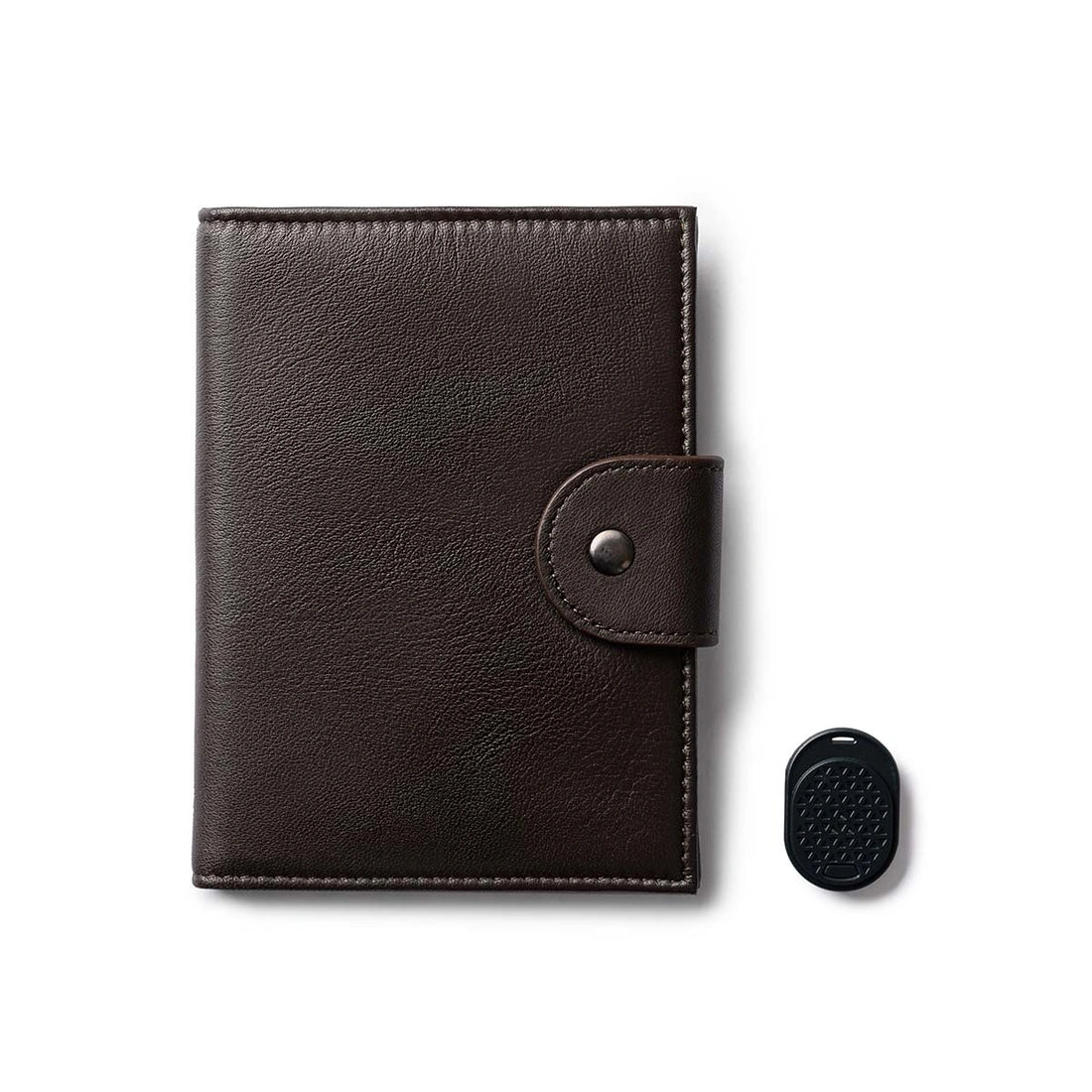 Orbit Smart Passport Holder Bi-Fold in Brown leather with Dolphin Max tracker attached to a passport and travel essentials
