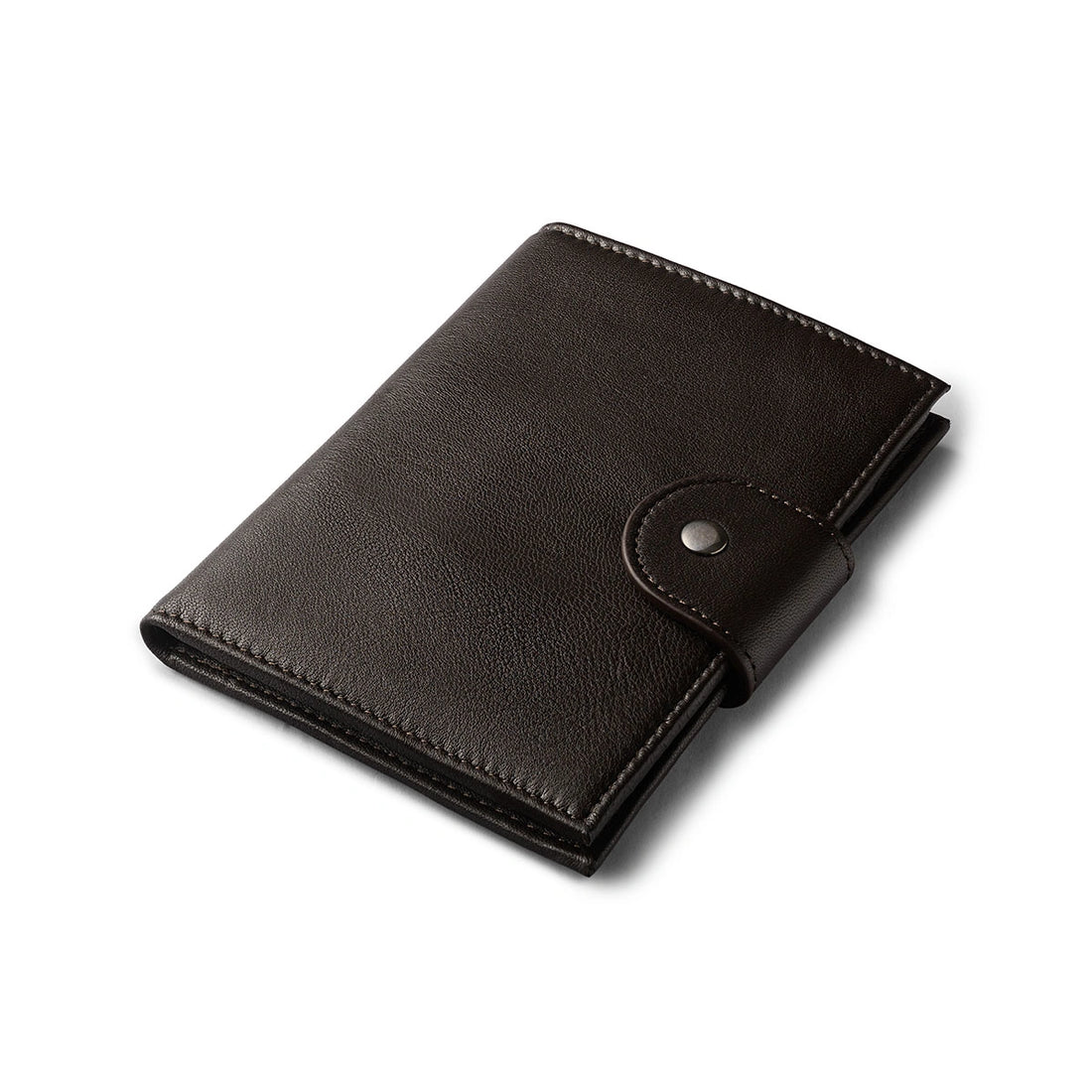 Orbit Smart Passport Holder Bi-Fold in Brown leather with Dolphin Max tracker attached to a passport and travel essentials